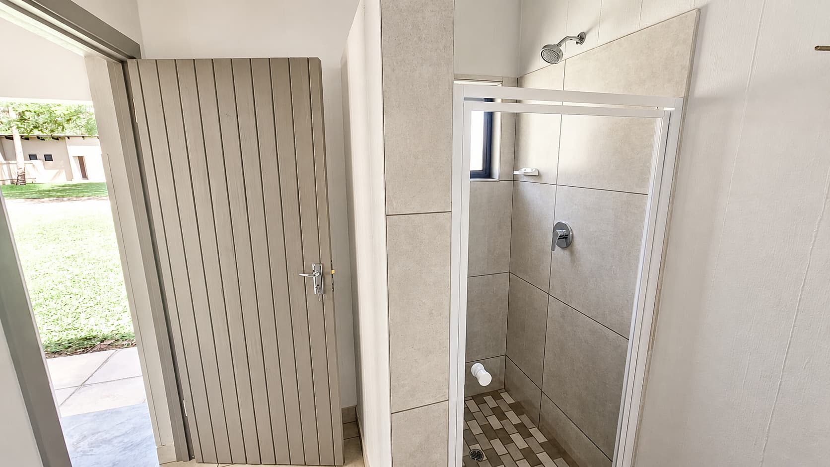Private shower inside a Beachfront stand’s ablution