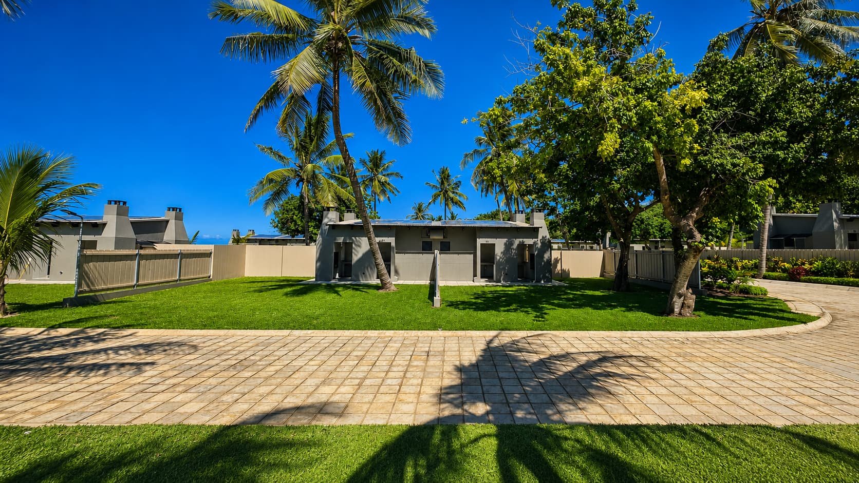 Premium stands with palm trees and private braai chimneys