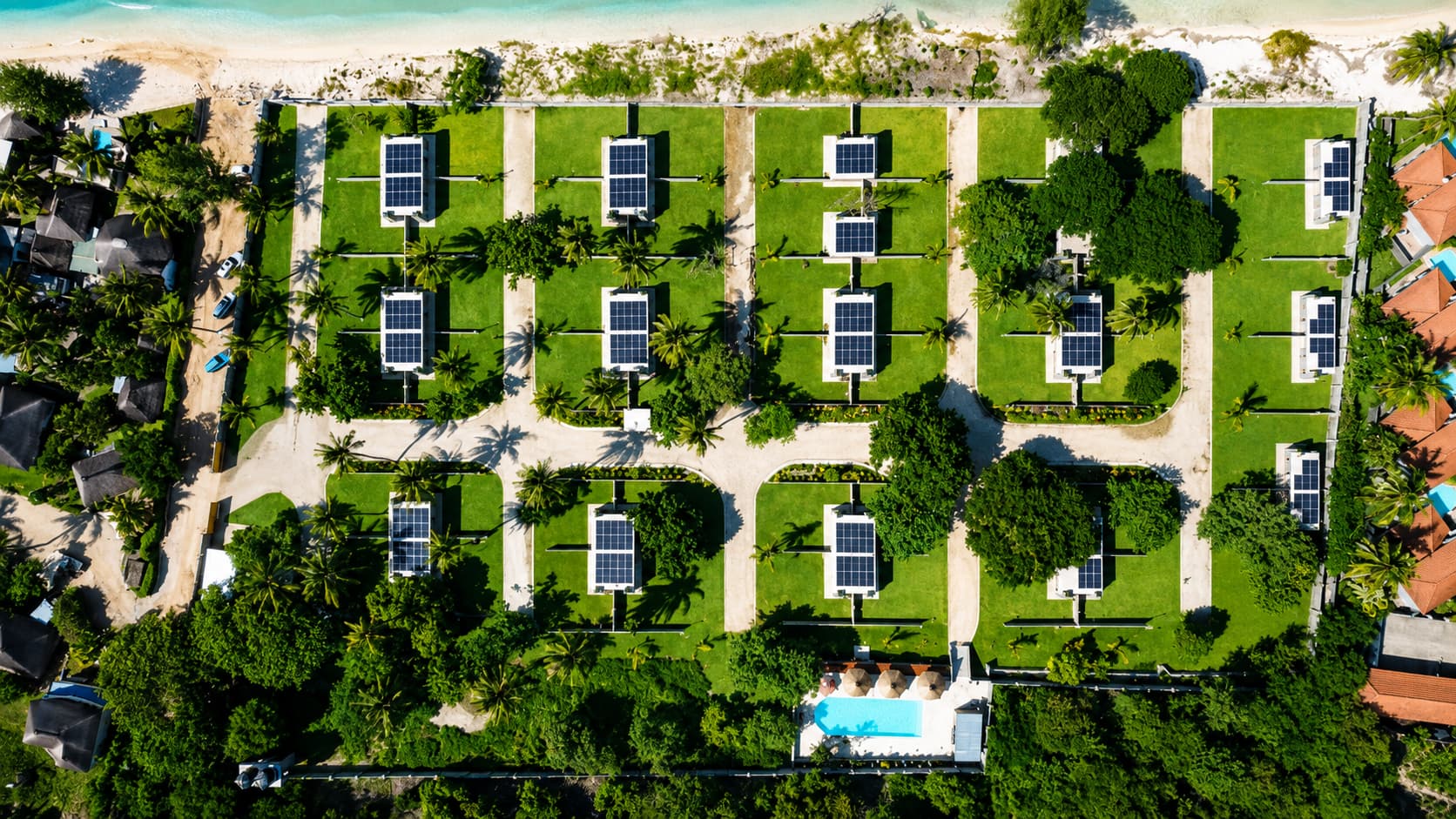 Aerial view of the full campsite layout — grassed stands, solar panels and the swimming pool